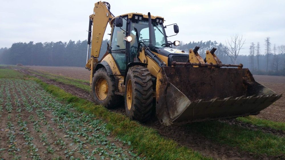 Usługi Koparko-ładowarka caterpillar 444e wykopy ,prace ziemne