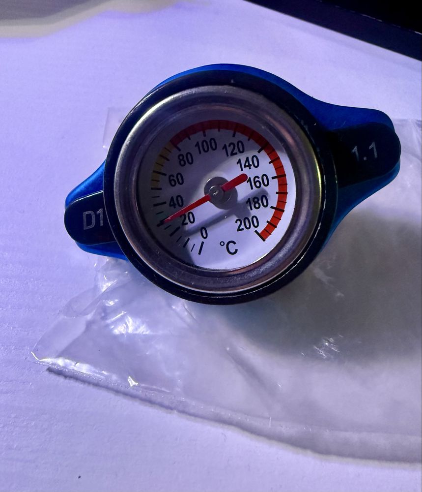 Tampa de radiador com temperatura