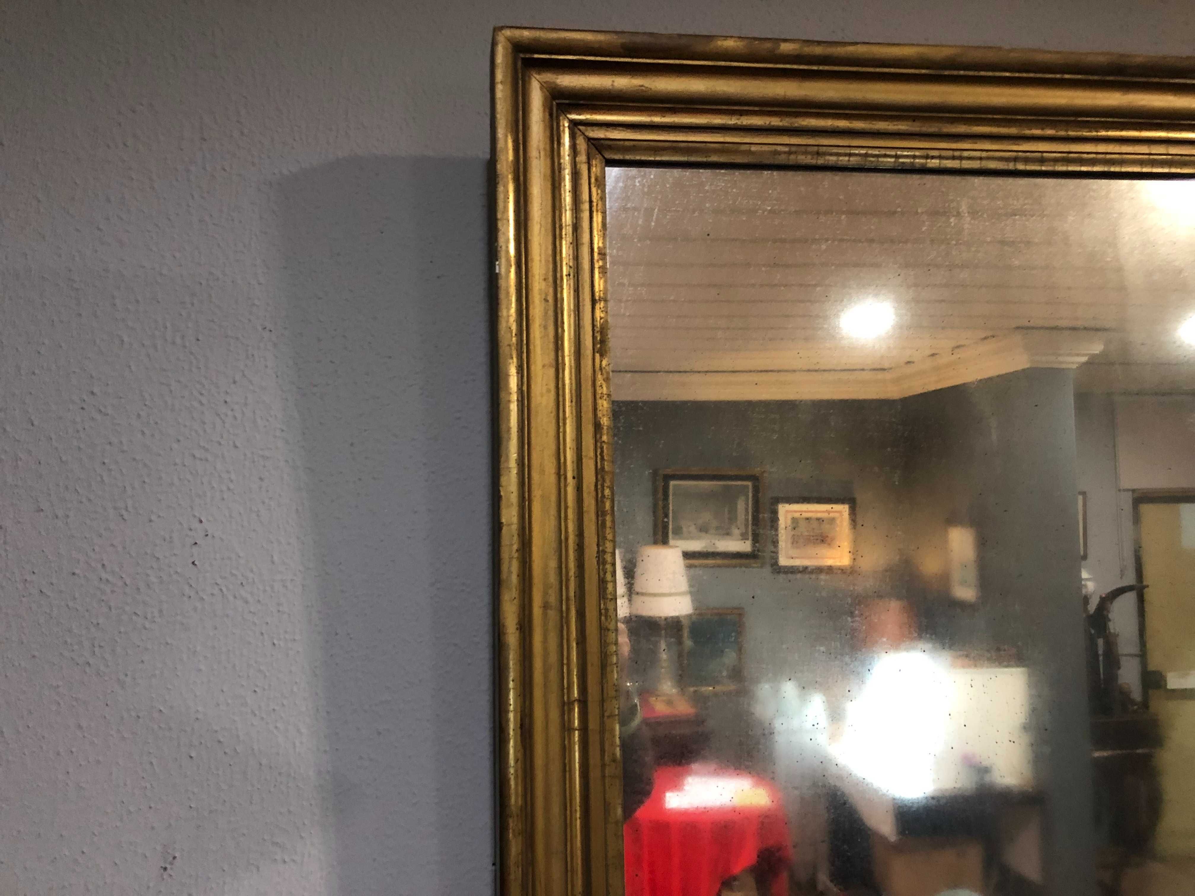 Espelho Sec XIX em madeira dourada a ouro fino