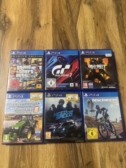 PlayStation 4 500GB + 2 comandos + 6 jogos + estação de carregamento