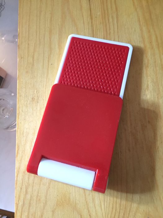 Acessório telemóvel suspensão para ver filmes. Novo. Encartável