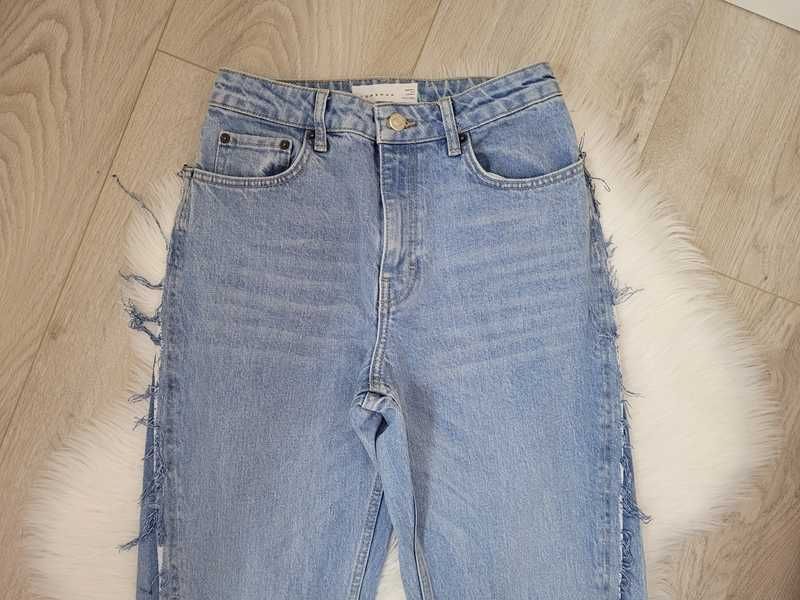 Niebieskie spodnie dżinsy z rozcięciami, Topshop, W25 L 34 (S, 36)