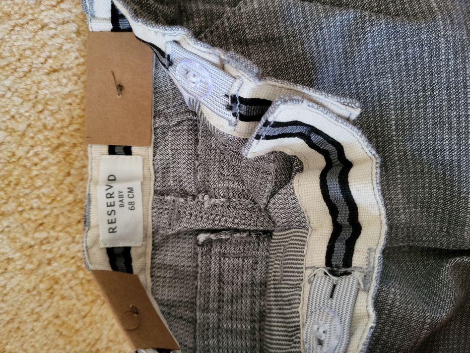 Nowe spodnie Chino Reserved 68, regulacja