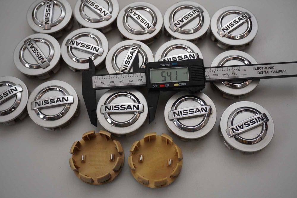 Dekielki oryginał Nissan OE 54mm 40342 AV610 srebrne 4sztuki