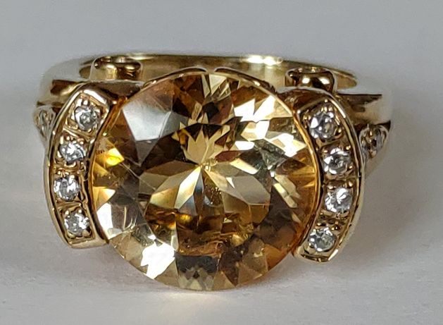 Srebrny (złocony) pierścionek z topazem i cyrkoniami r. 15