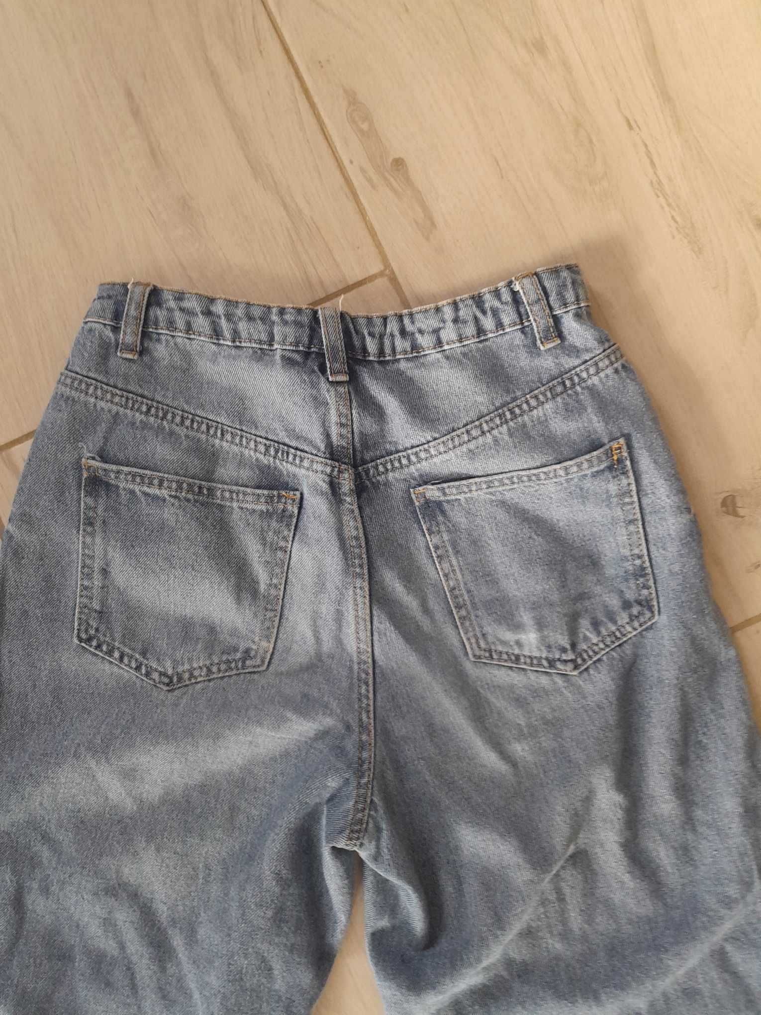 Spodnie jeans dziewczęce z dziurami rozmiar 165