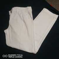 Białe spodnie chinosy next