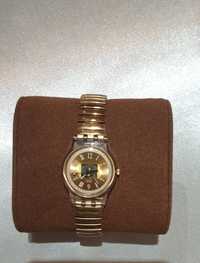 Relógio swatch dourado