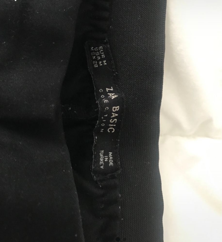 Calças pretas com faixa lateral branca - Zara