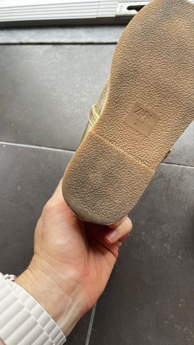 Golden shoes for a girl