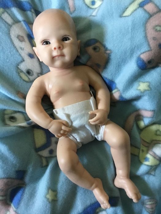 Boneca bebé reborn,verdadeiro silicone (artigos novos)