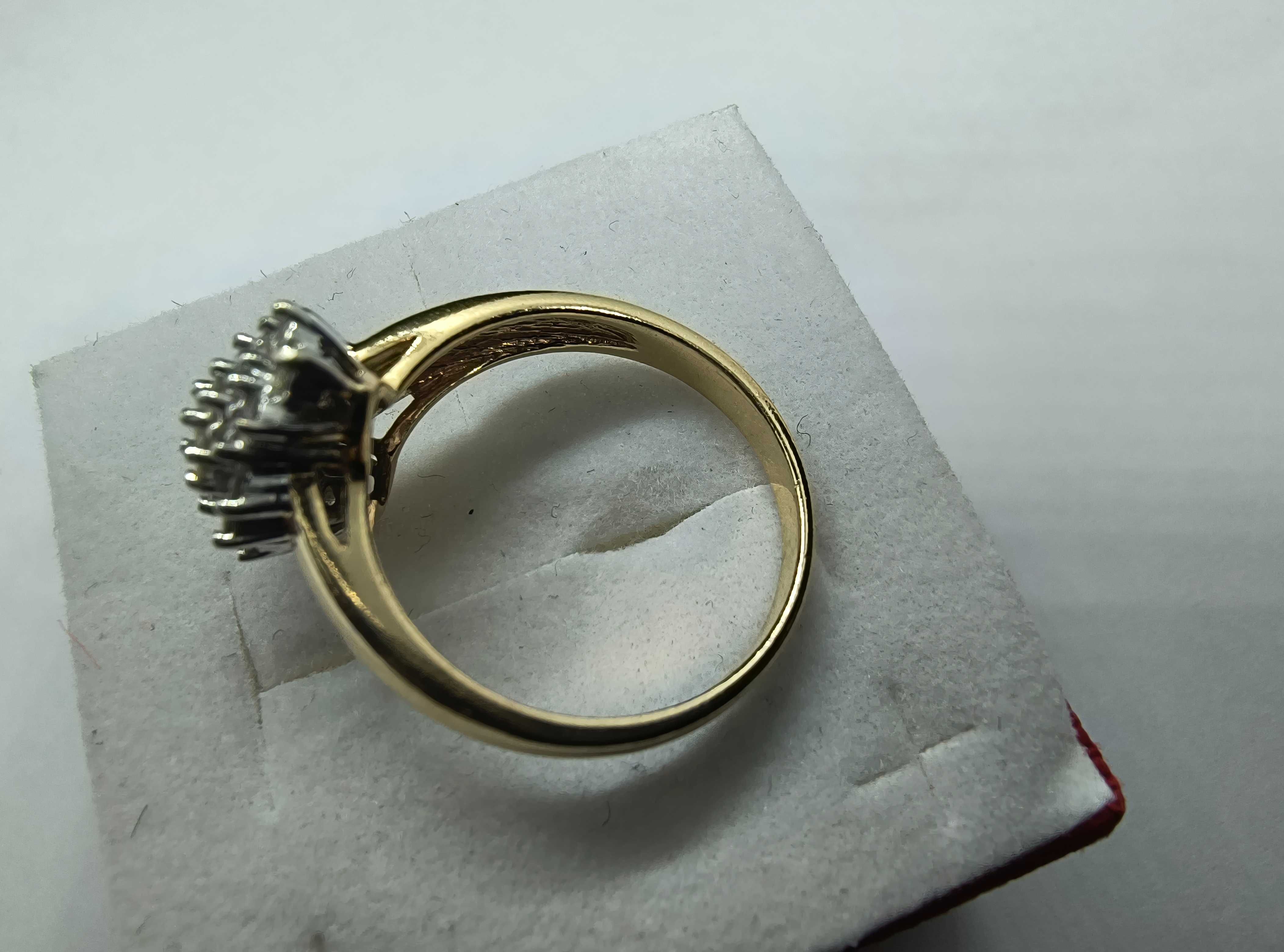 Złoty pierścionek z brylantami 0.79ct Si1/H-J certyfikat