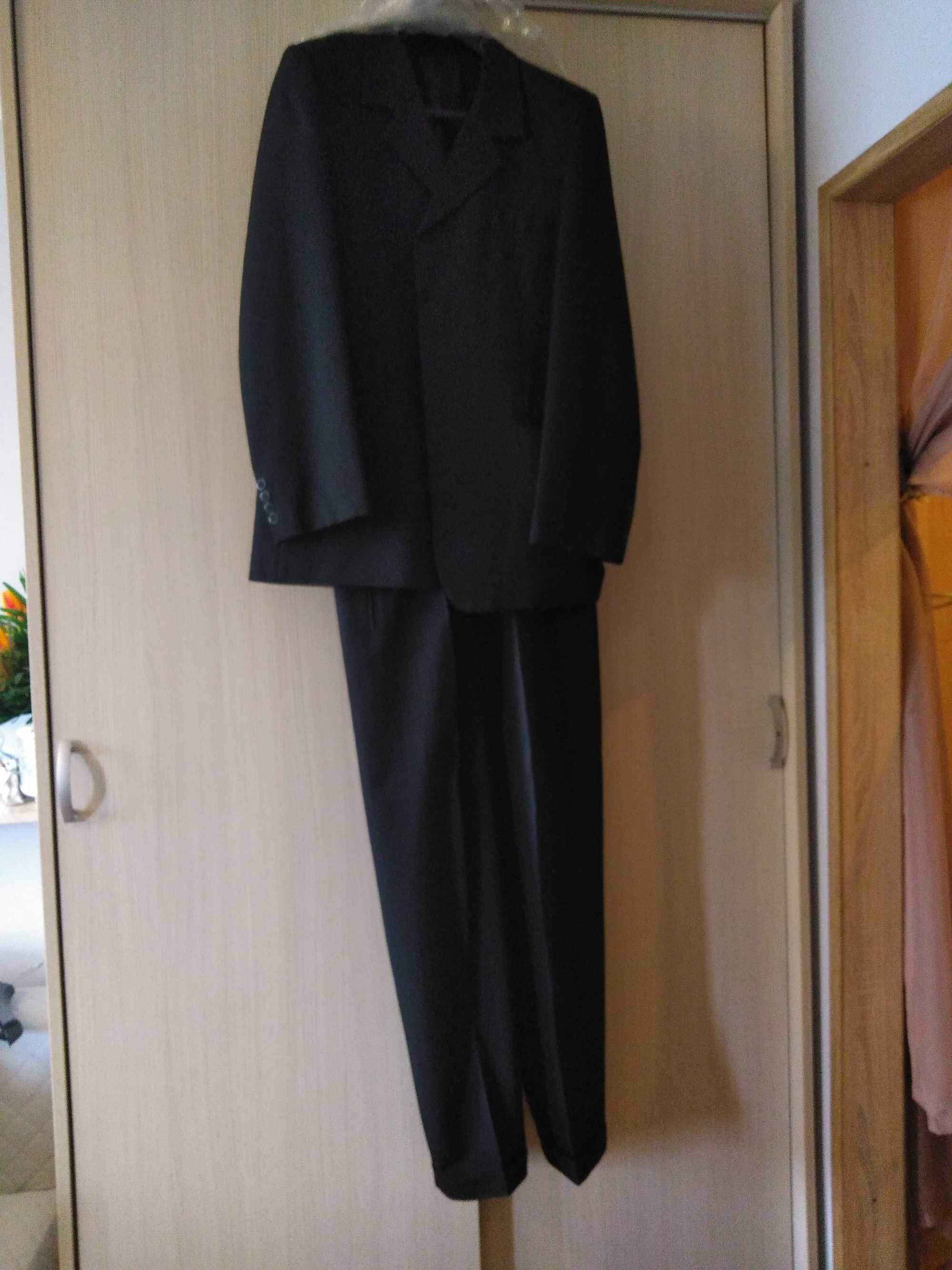 sprzedam ciemny garnitur /roz. 48, wzrost 182 cm/stan idealny.
