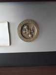 Medalha de latão planetário.