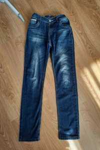 długie jeansy ciemny jeans na gumce z kieszeniami dżinsy