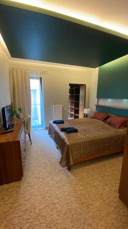 Apartament nad jeziorem z TARASEM i miejscem parkingowym
