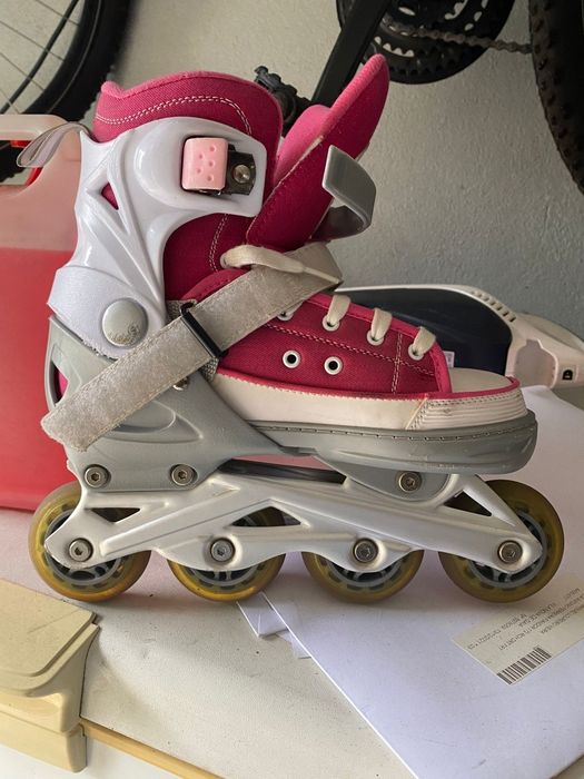 Patins em linha rosa e choc vi