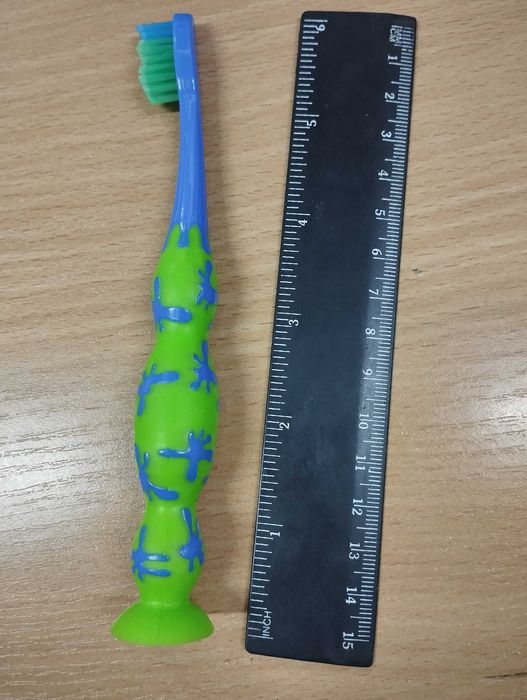 Новенька дитяча зубна щітка на присосці