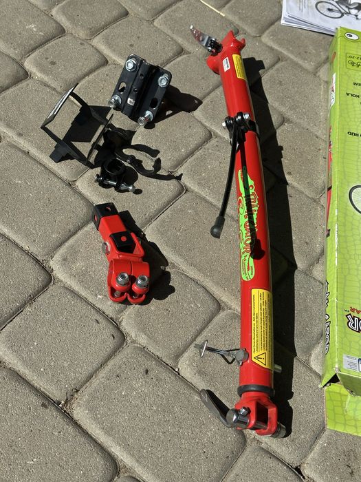 Trail-Gator drążek tandemowy, czerwony. Prowadnica do roweru Uchwyt