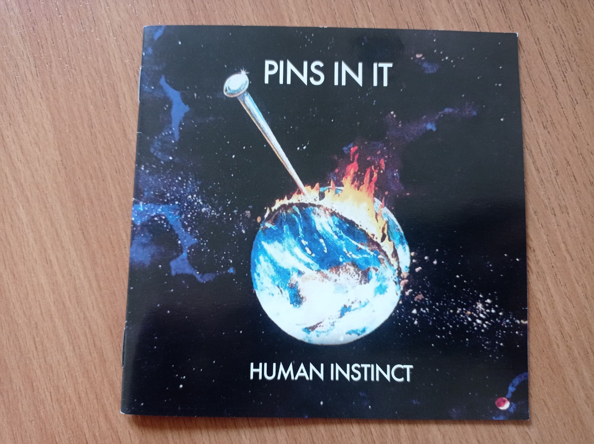 The Human Instinct - Pins on it