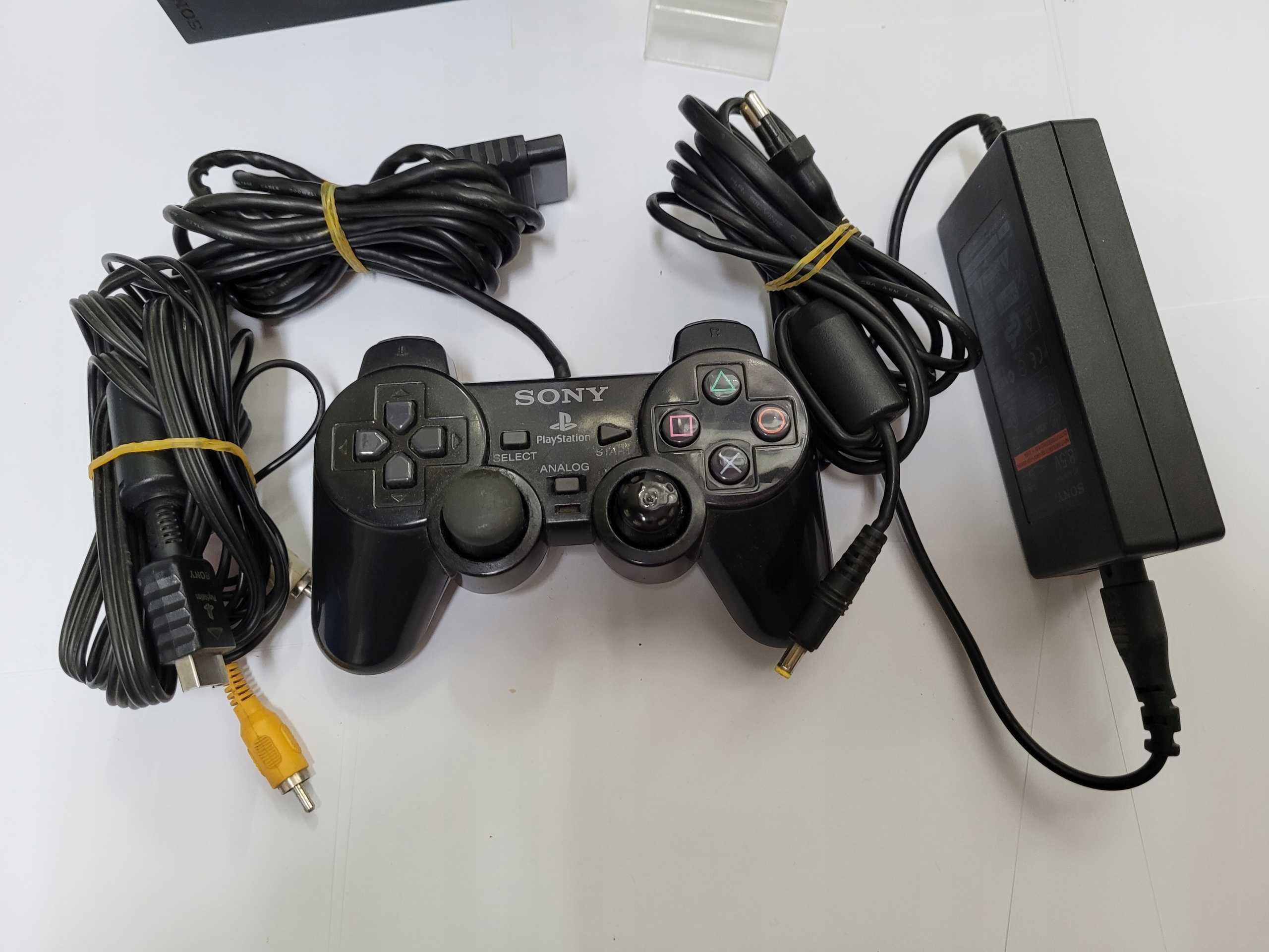 Konsola Sony PS 2 slim uzywana z oryginalnym zasilaczem