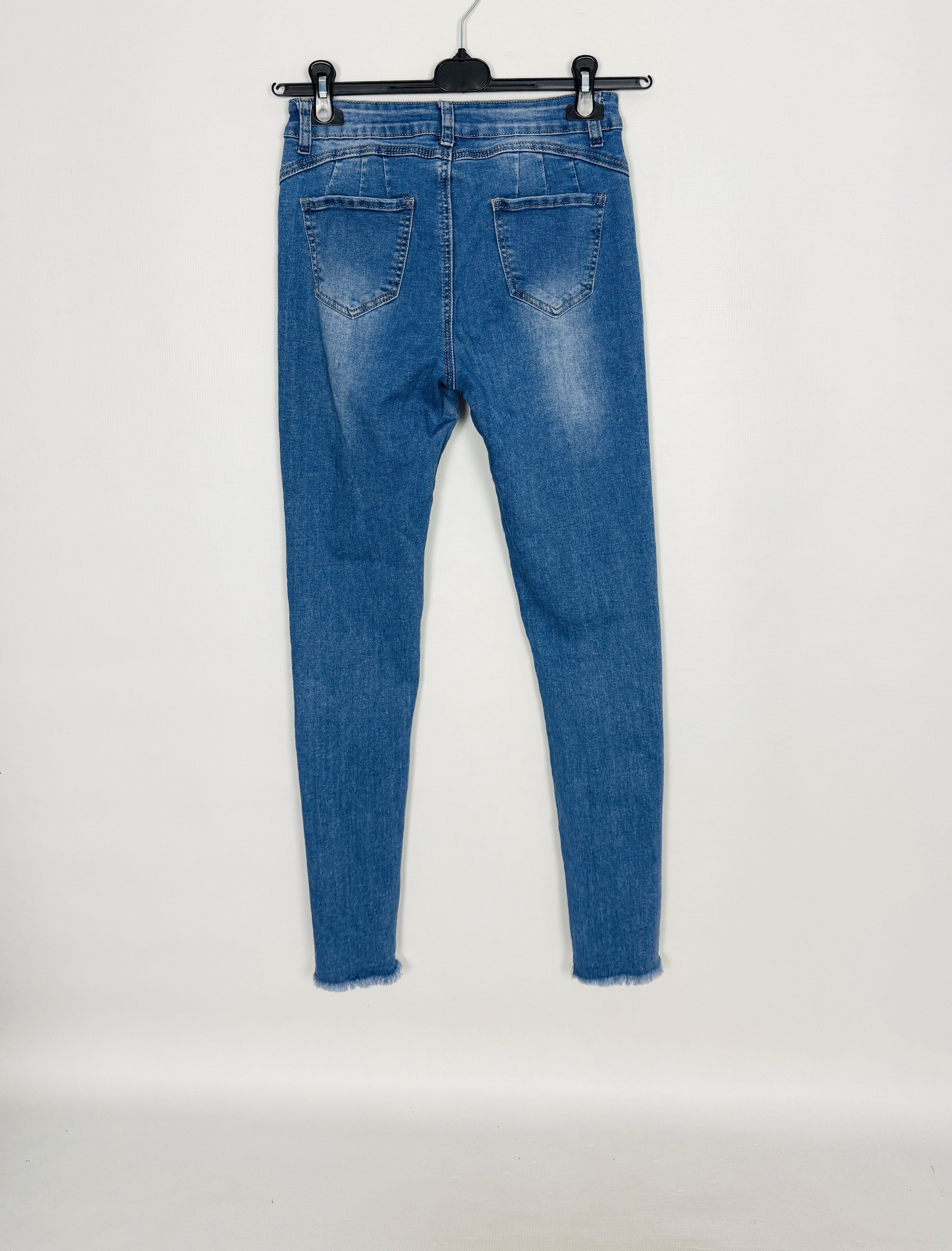 Jasnoniebieskie jeansowe spodnie rurki z przetarciami S 36
