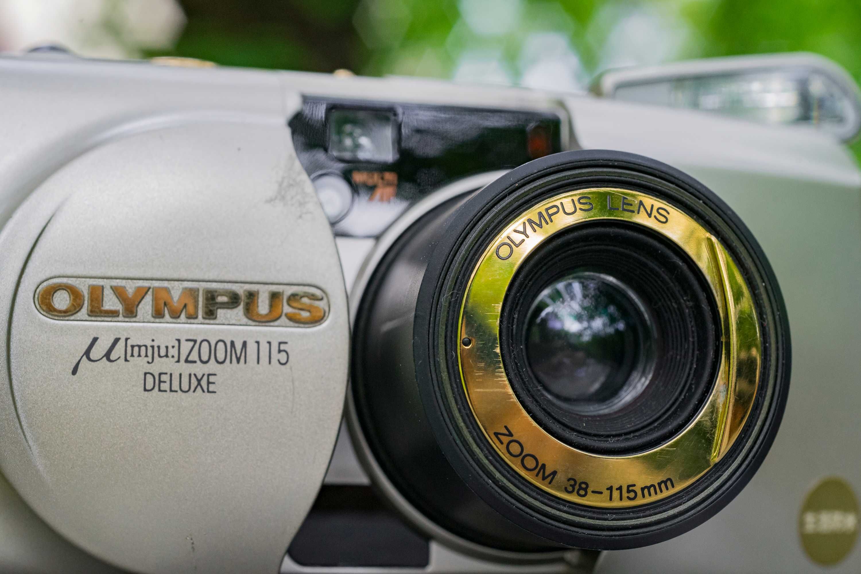 Olympus uMJU Zoom 115 Deluxe Gold aparat analogowy małpka futerał