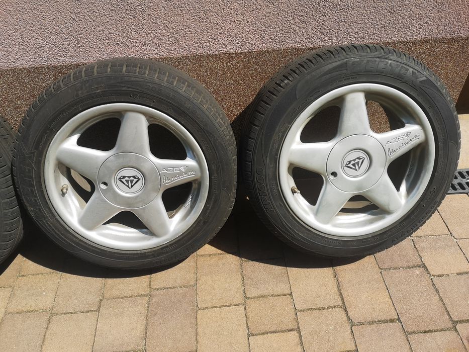 4x felga aluminiowa 15" 4x114.3 ET40 plus opony wielosezonowe