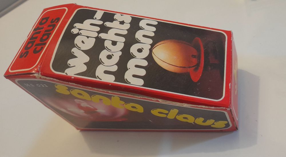 Brinquedo de lata mecânico pai natal com caixa