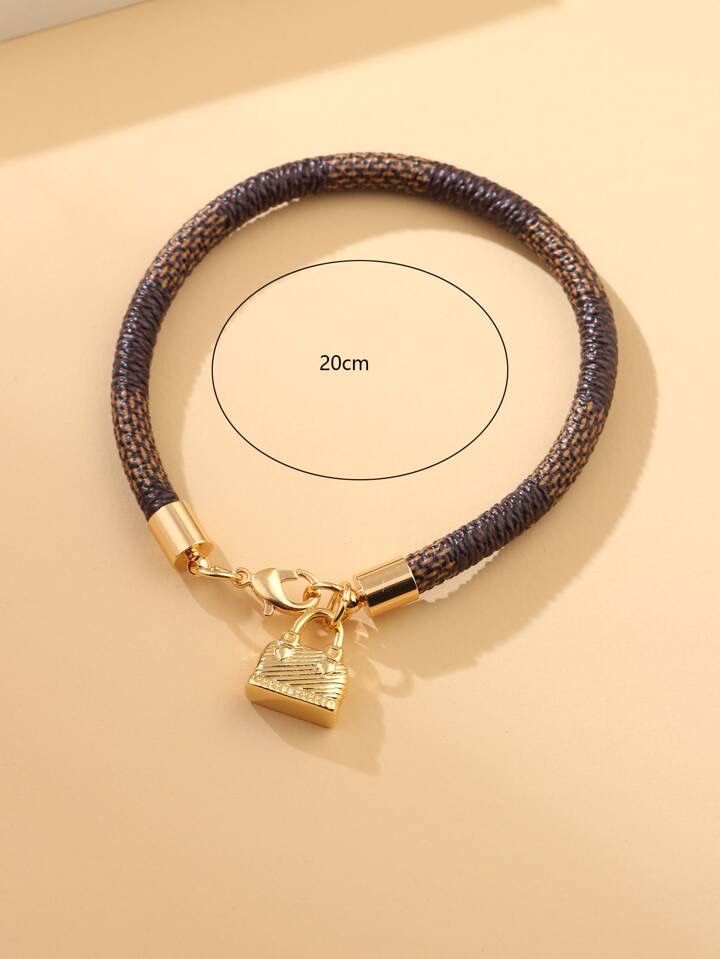 Modna bransoletka z przewieszka charms w kształcie torebki