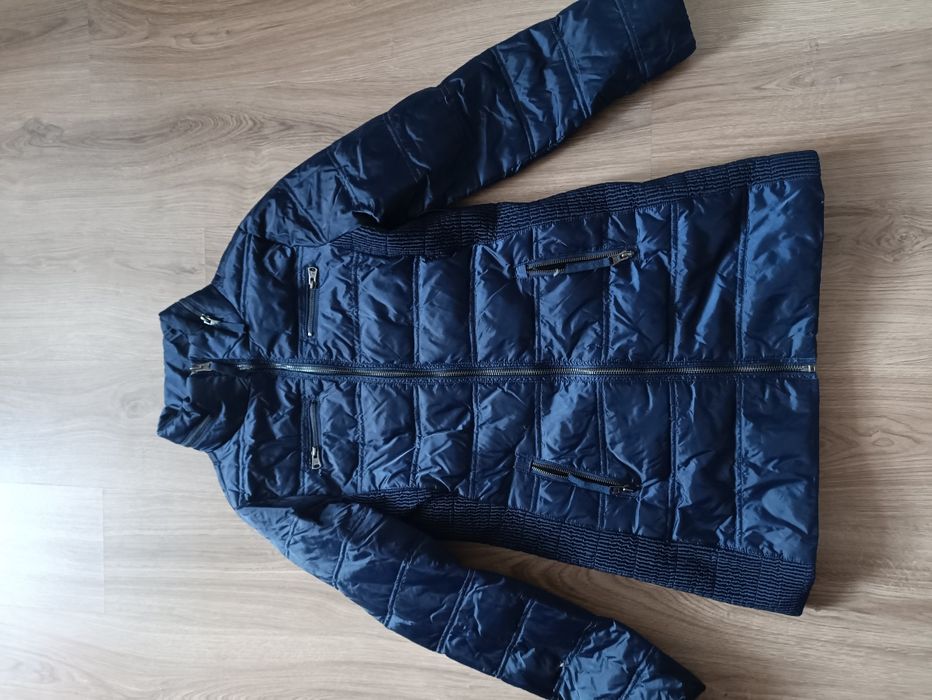 Куртка на пуху б/у на 46 розмір