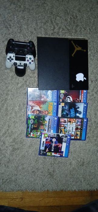 Playstation 4 usada + jogos + comandos + carregador