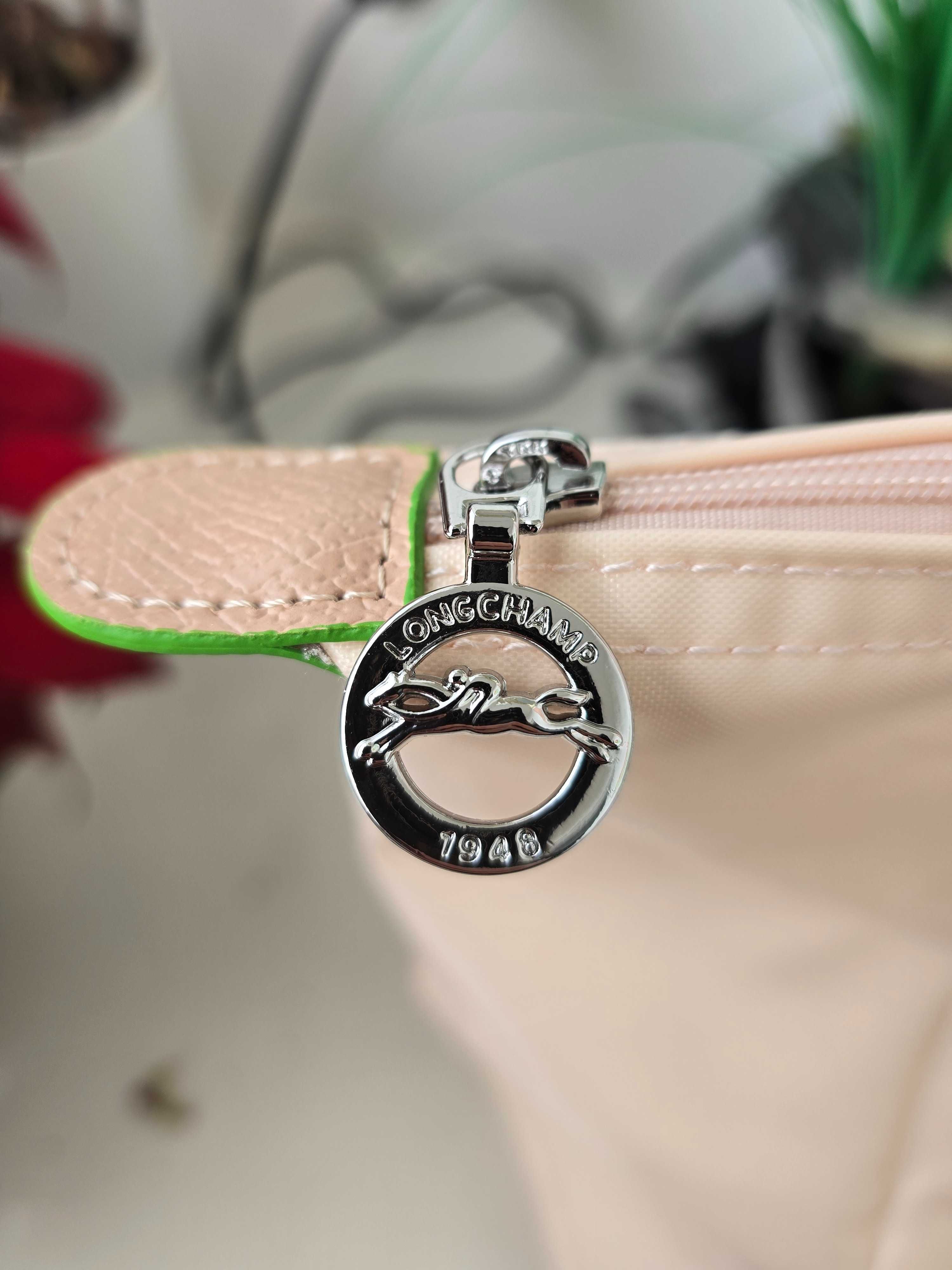 Mala Longchamp em rosa claro. Tamanho L.
