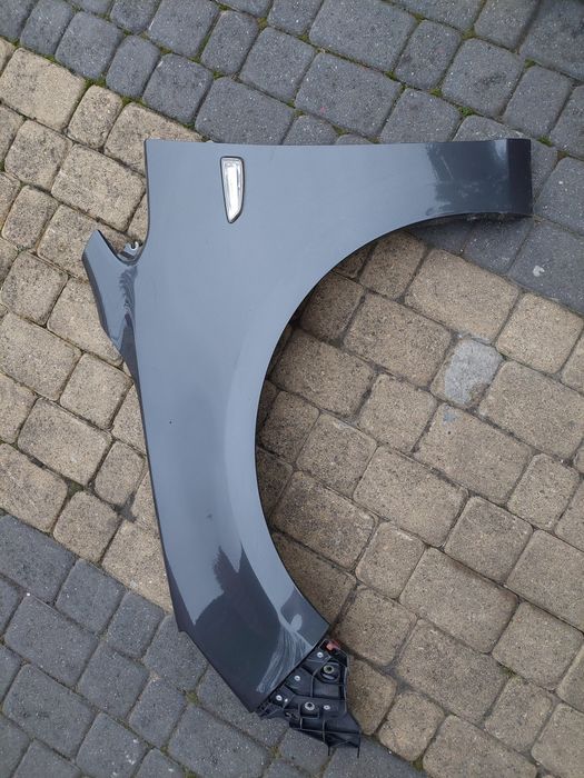 Błotnik lewy przód Astra J lV kombi 2011rok.lakier z177