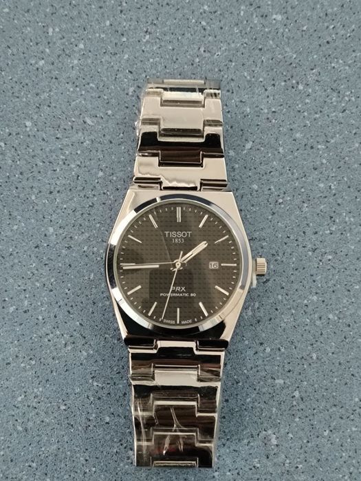 Годинник Tissot PRX, Patek Phillippe Nautilus.