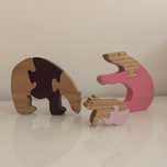 Familia de ursos esculpidos em madeira - puzzle