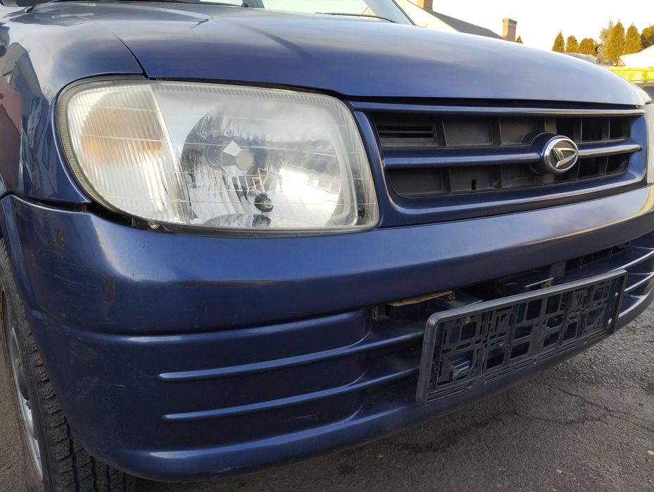 Daihatsu Cuore 1.0i 5D 1999r.Zderzak przedni.
