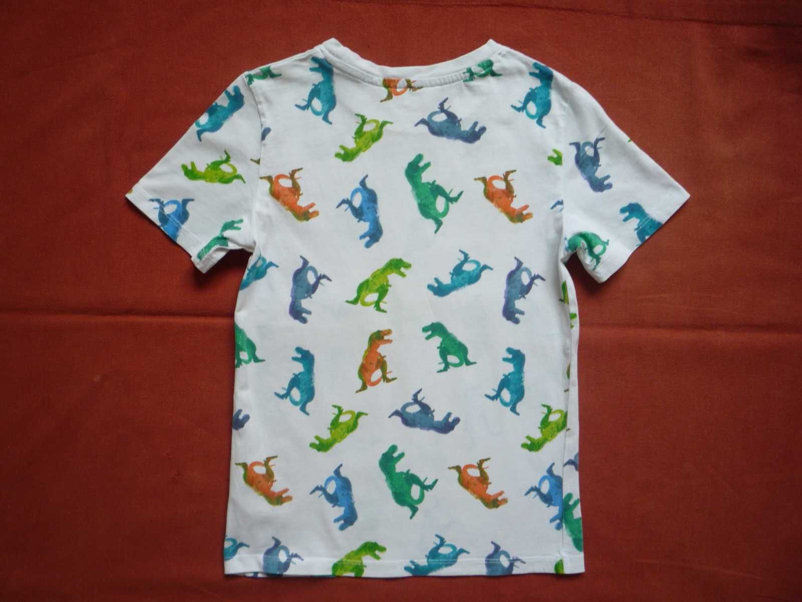 H&M r. 122/128 Biała koszulka w kolorowe dinozaury