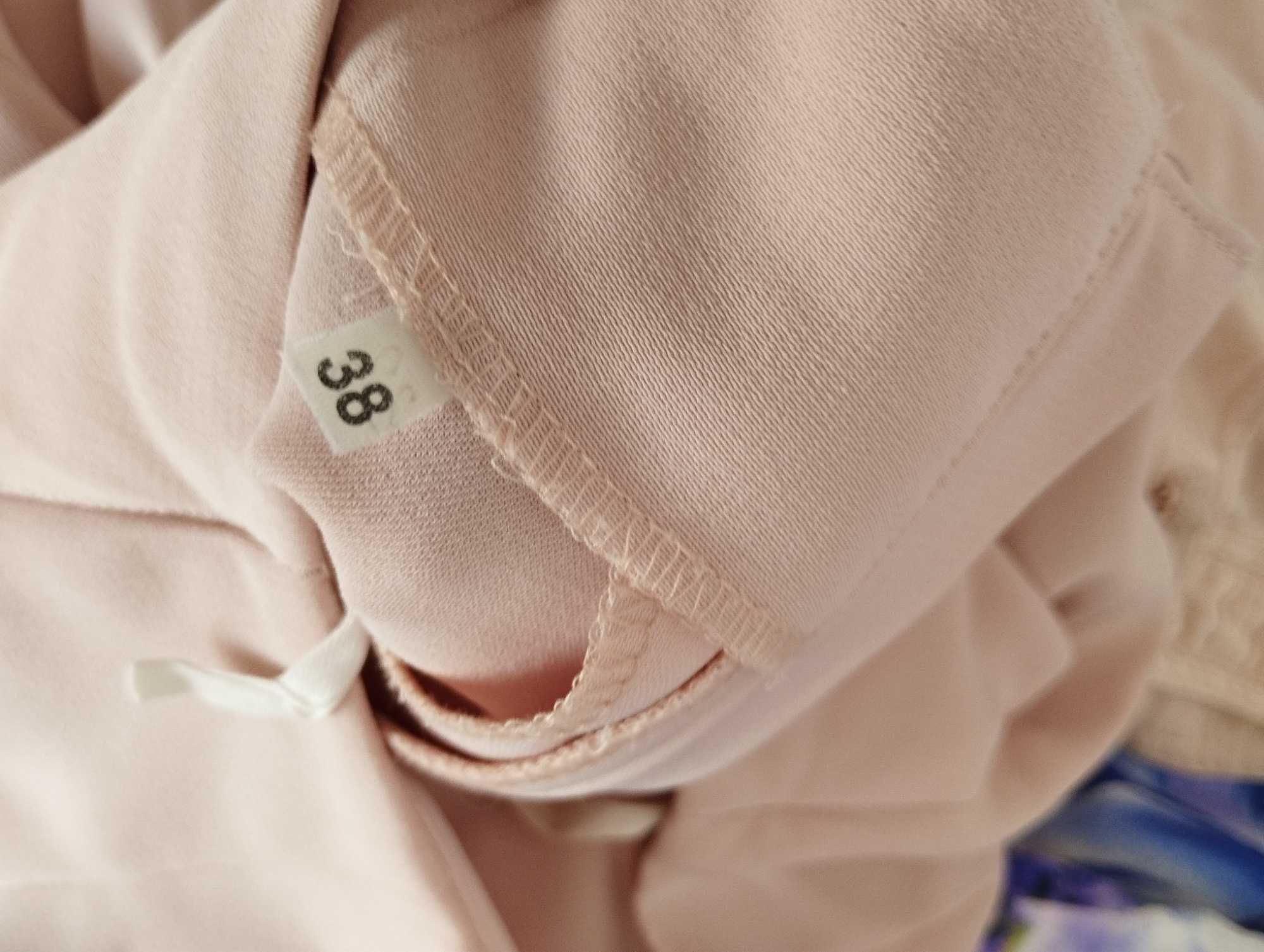 Spodnie eleganckie jasno różowe 38
