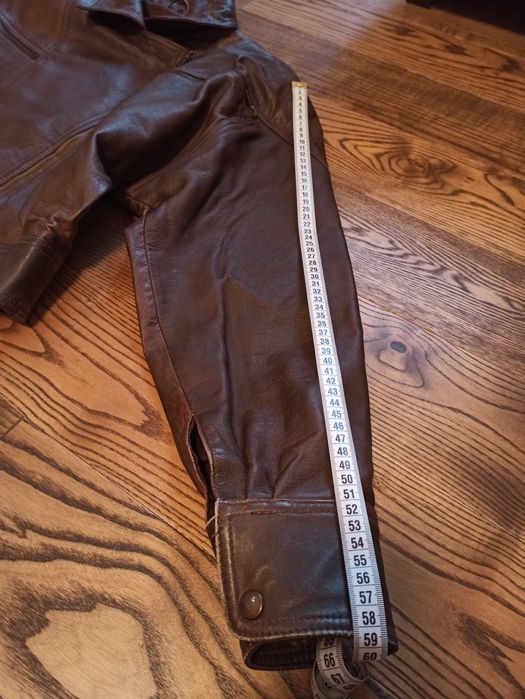 Кожаная куртка - размер 50, кожаная юбка - размер 52