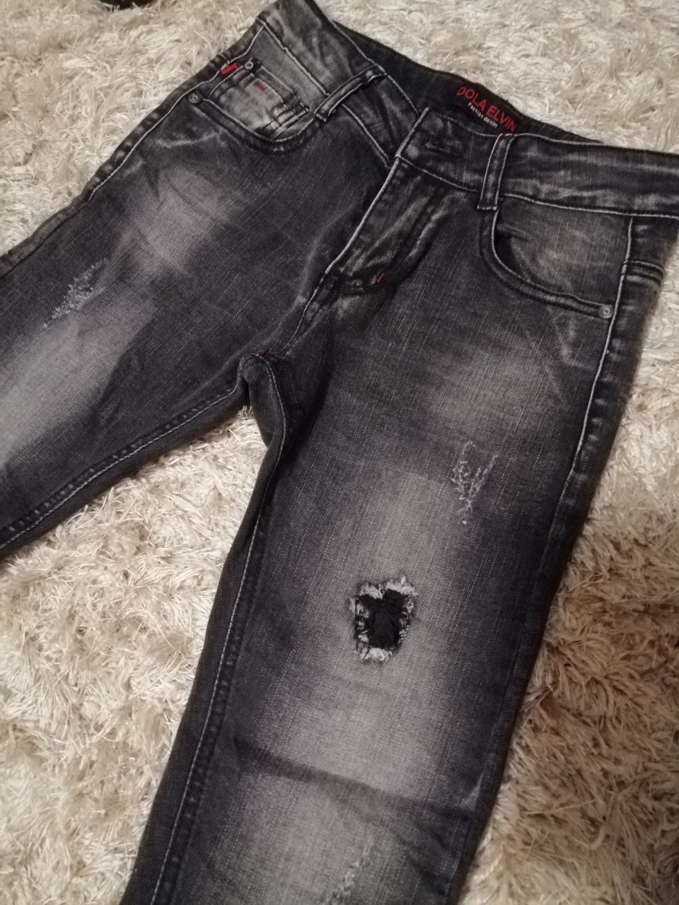 Spodnie jeans dla chłopca modne przetarcia