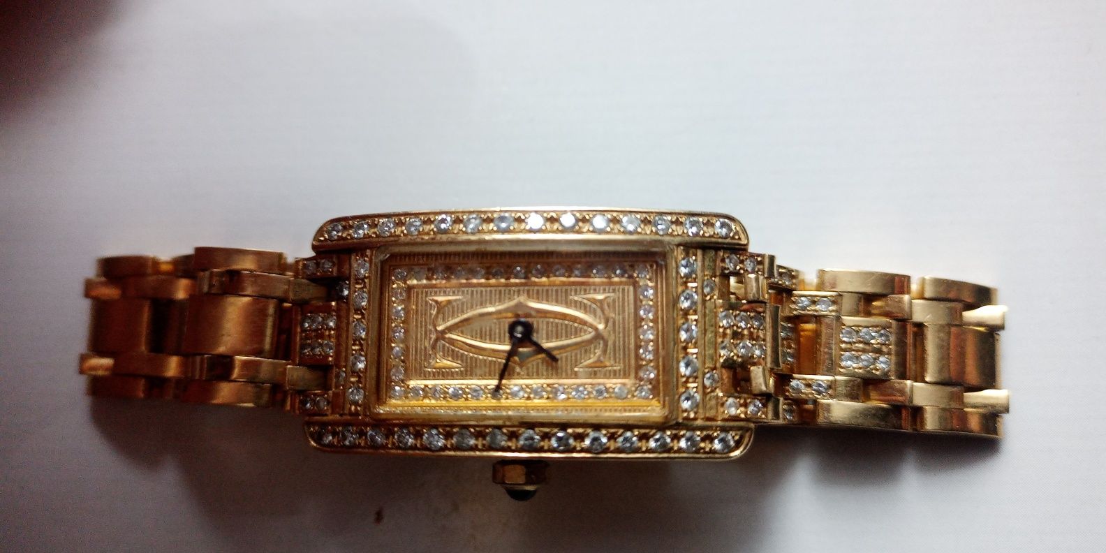 Złoty zegarek, cartier z brylantami, pr.750