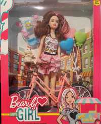 Lalka z rowerem i balonikami