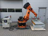 Zrobotyzowana paletyzacja worków kartonów paletyzator robot KUKA ABB