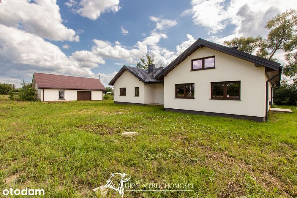 - Dom parterowy i budynek gospodarczy z garażem -