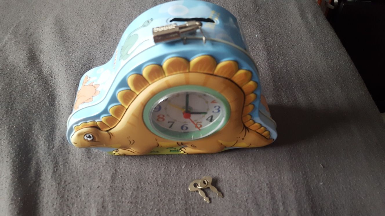 Zegar skarbonka z dinozaurem