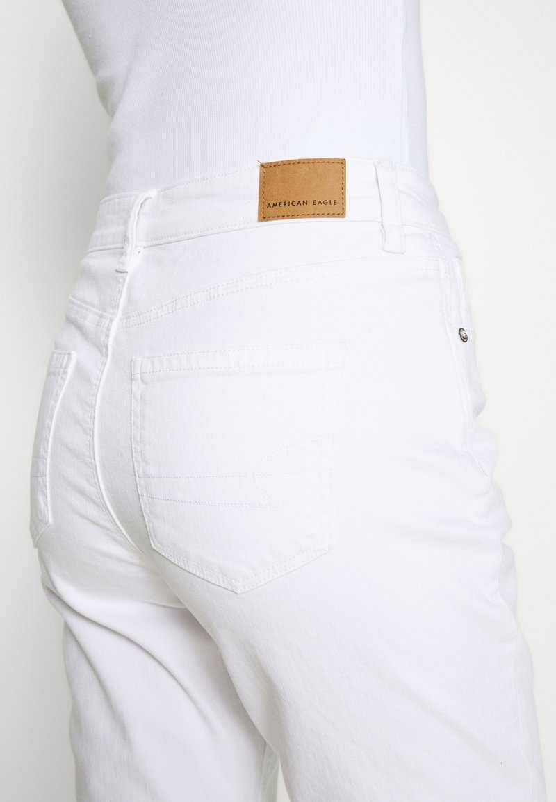 Białe spodnie jeansowe American Eagle 40/L