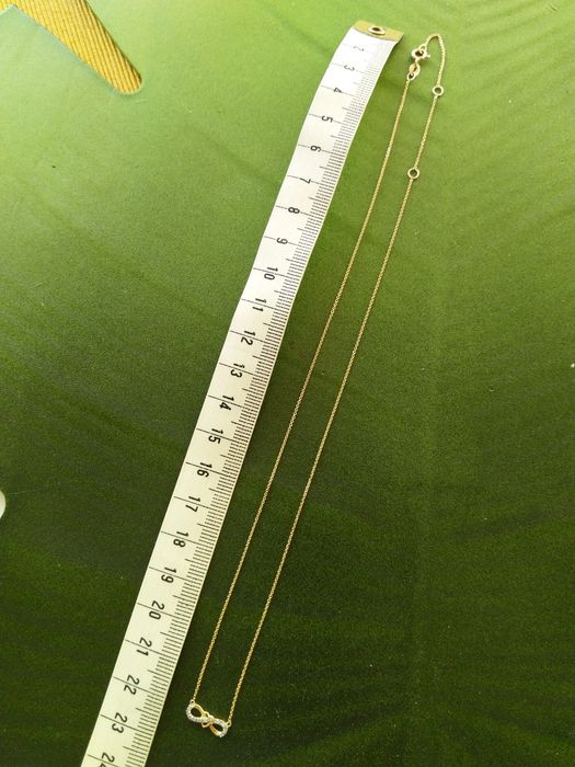 Złoty naszyjnik nieskończoność z sercem