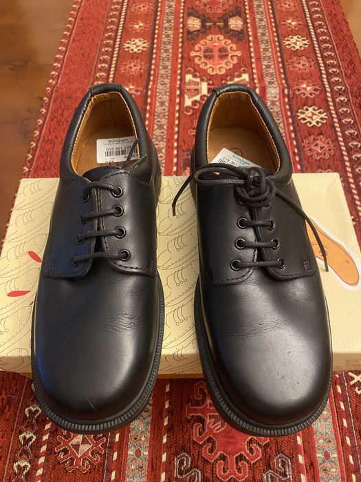 Sapatos de criança em couro