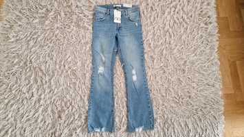 Zara spodnie jeansy flare z przetarciami / rozdarciami 164 cm zara